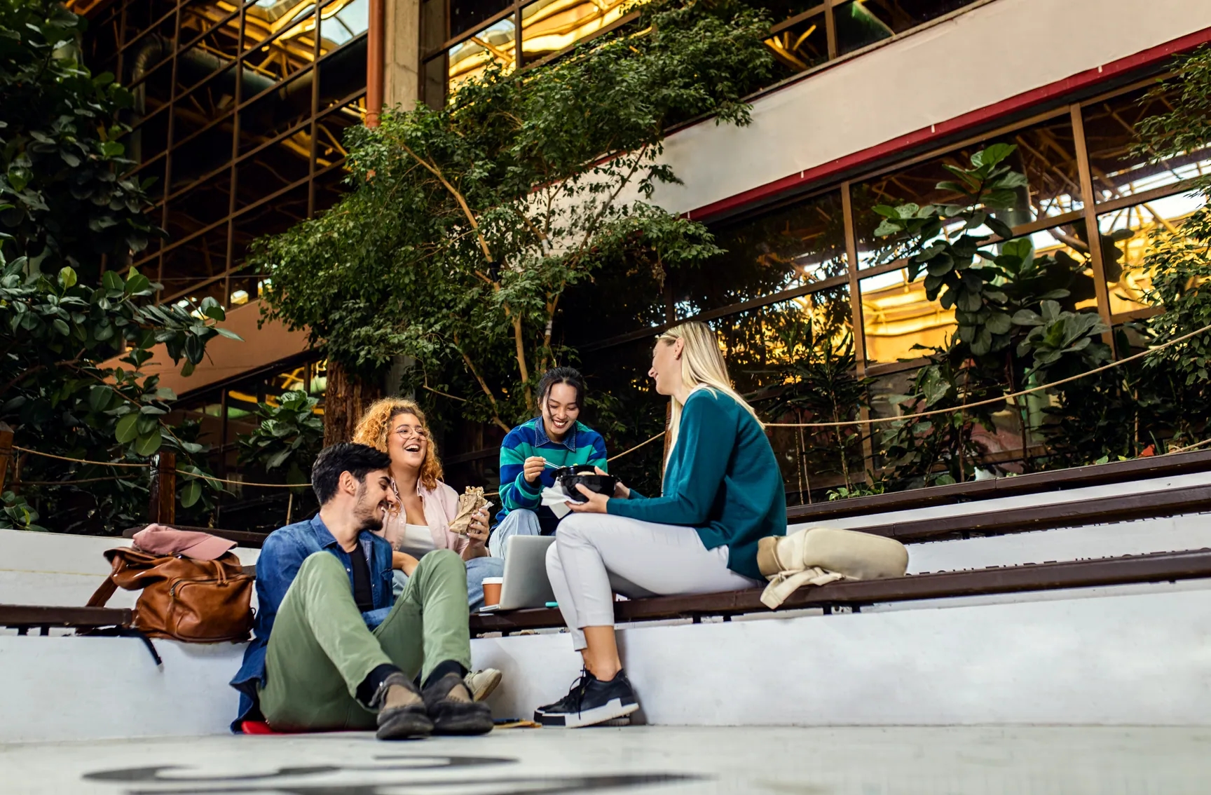 Kids studying and having fun in a university table.